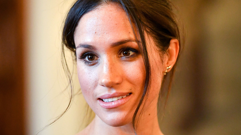 Meghan Markle smiles during an outing