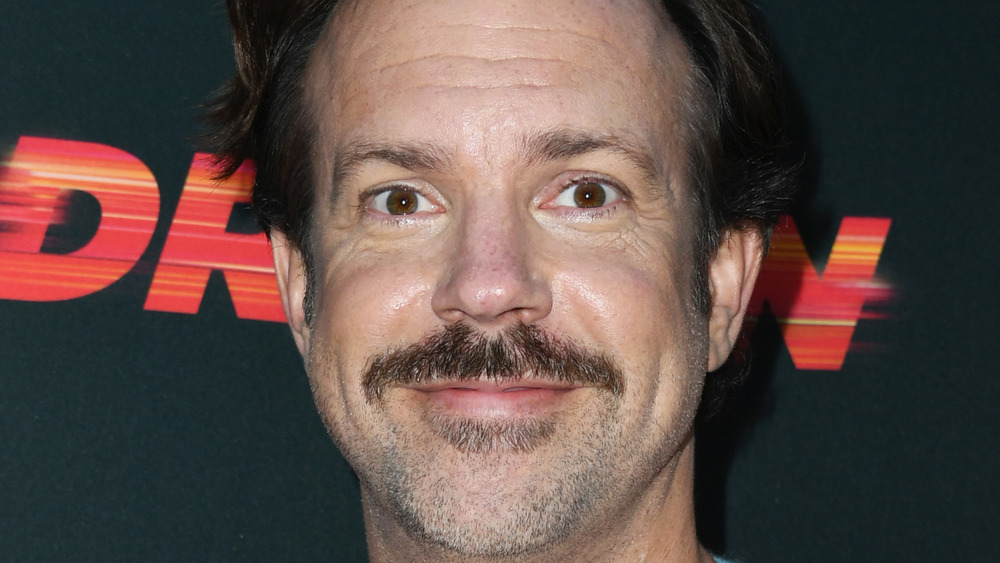 Jason Sudeikis smiling with wide eyes