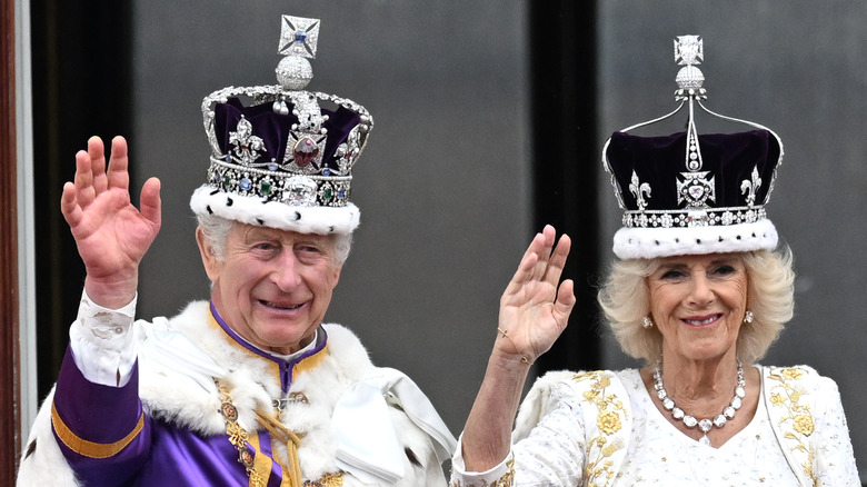 King Charles and Queen Camilla waving