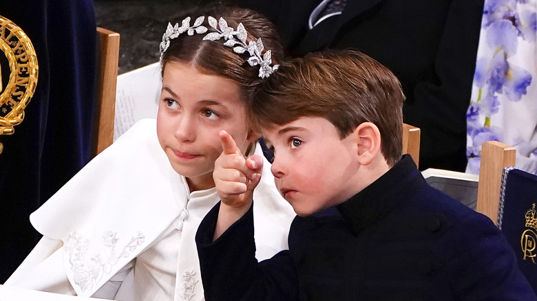 Princess Charlotte with Prince Louis pointing