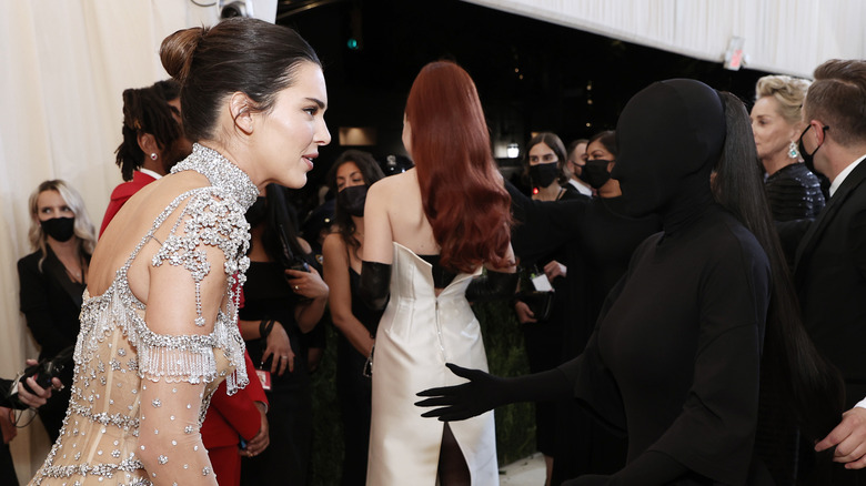 Kendall Jenner talking to Kim Kardashian