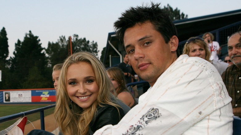Hayden Panettiere and Stephen Colletti sitting in baseball stands