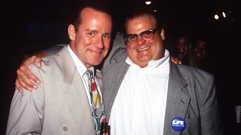 Phil Hartman and Chris Farley smile