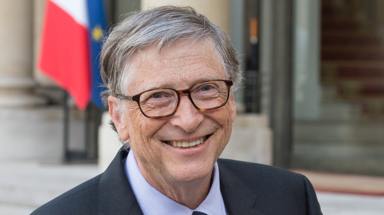 Bill Gates smiling and wearing suit in Paris