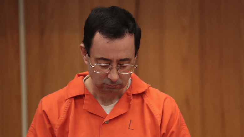 Larry Nassar bowing his head in court