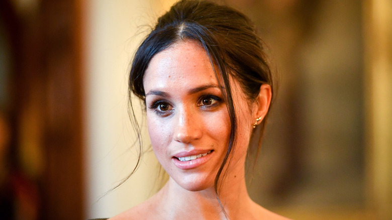 Meghan Markle gives a pensive look while on royal duties