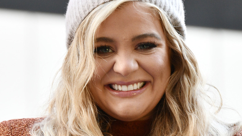 Lauren Alaina wearing hat and smiling at the Macy's Thanksgiving Day Parade in 2020