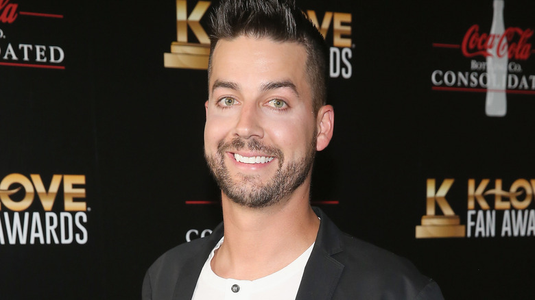 John Crist smiling and posing in 2018