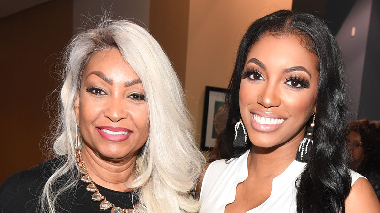 Diane Williams and Porsha Williams smile at an event