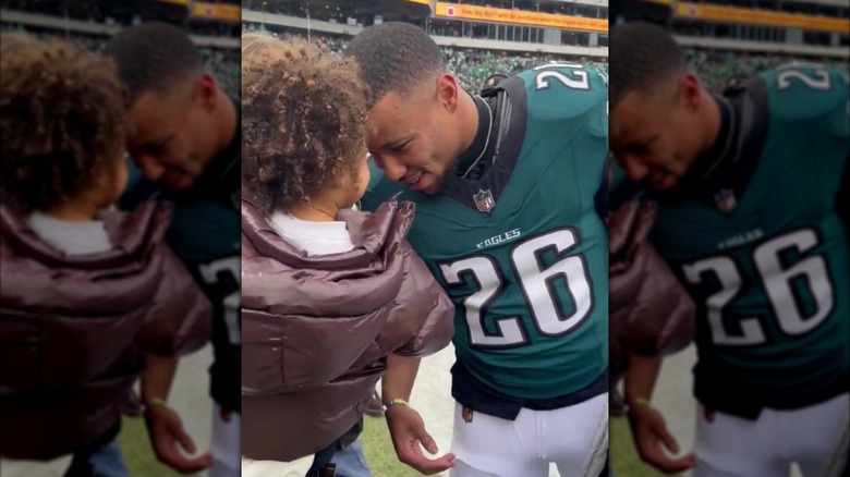 Saquon Barkley gently butting heads with his son S.J.