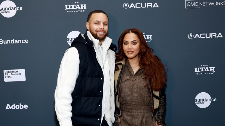 Steph Curry and Ayesha Curry posing at Sundance Film Festival in 2023