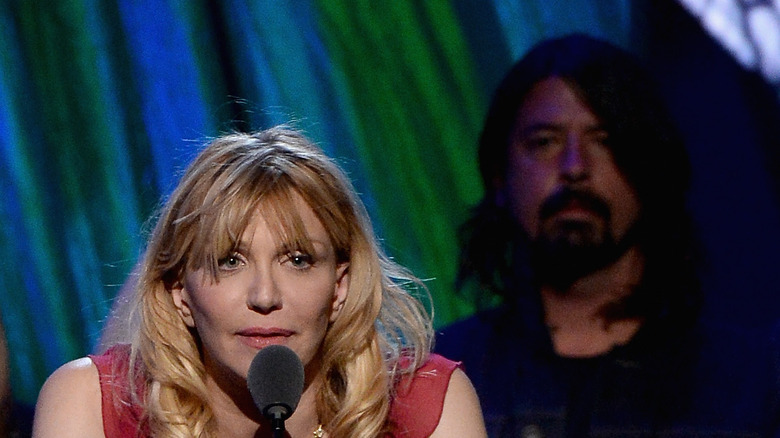 Courtney Love and Dave Grohl speaking on stage