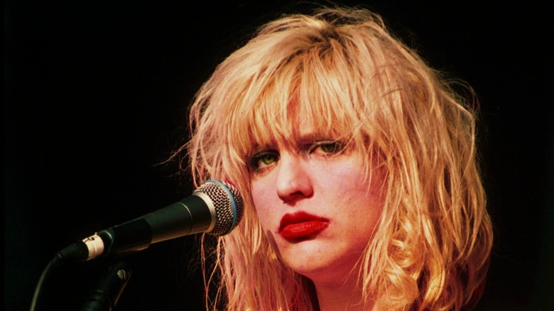 Courtney Love pouting onstage in the 1990s