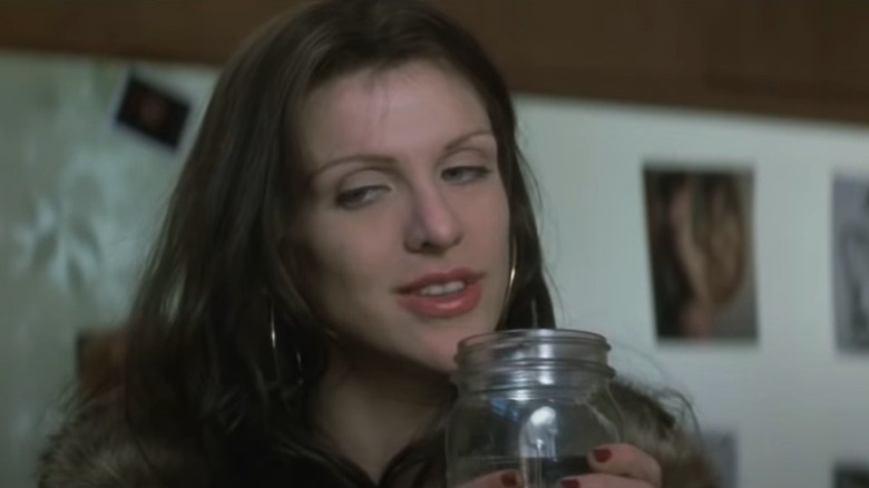 Courtney Love smiling as Althea in The People vs. Larry Flynt