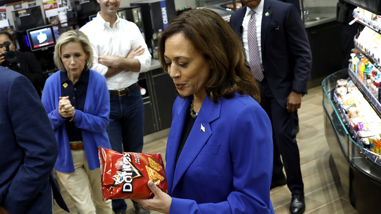 Kamala Harris holding a bag of Doritos