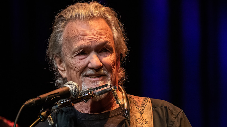 Kris Kristofferson smiling on stage in 2019