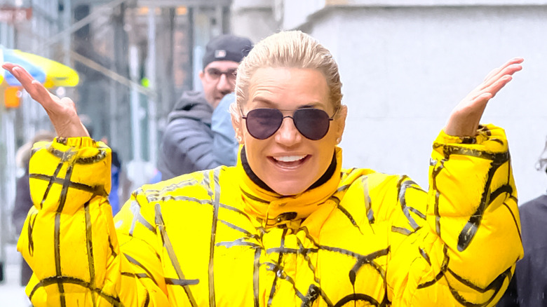 Yolanda Hadid smiling hands up