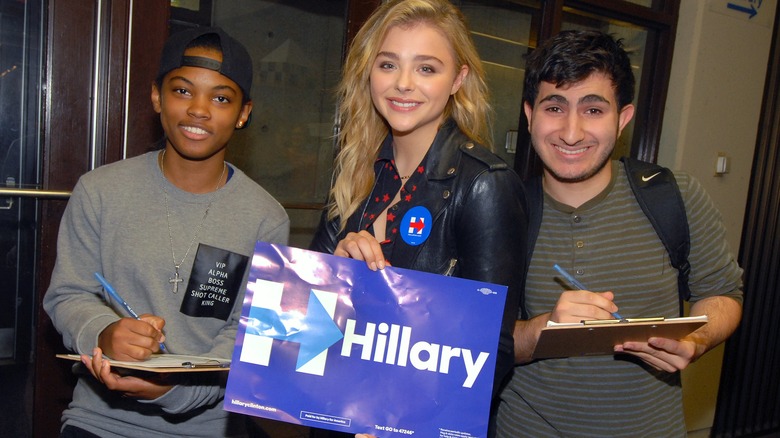 Chloe Grace Moretz holding a Clinton sign