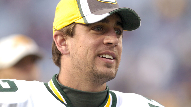 Aaron Rodgers posing in cap