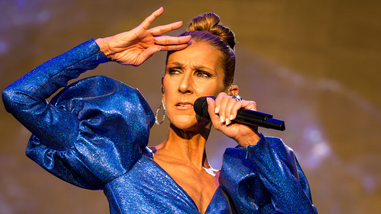 Celine Dion performing blue gown