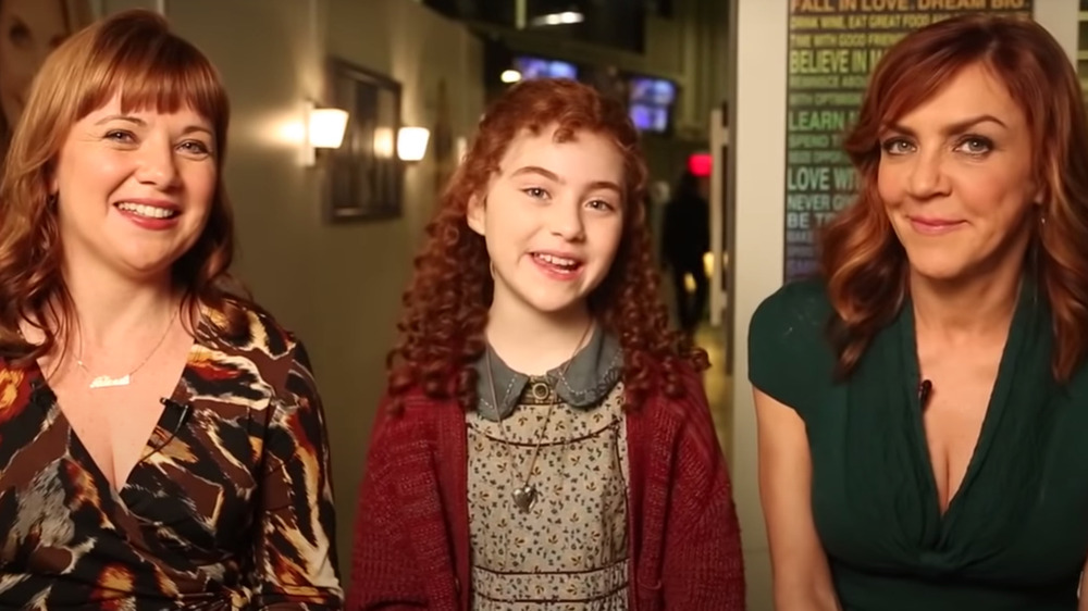 Aileen Quinn, Lilla Crawford, and Andrea McArdle smiling