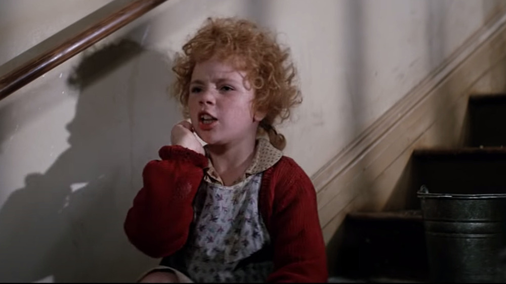 Aileen Quinn frowning as Annie