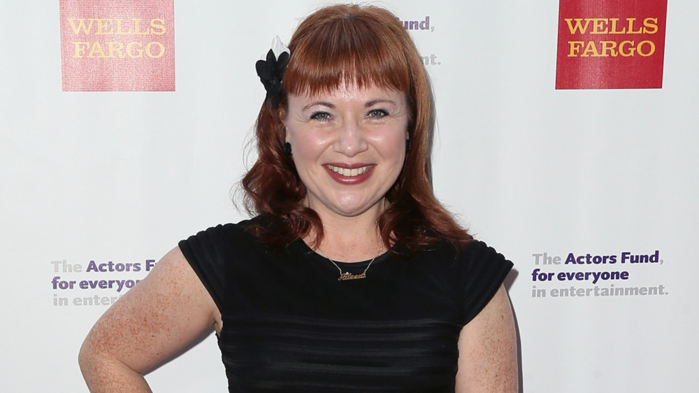 Aileen Quinn smiling on the red carpet