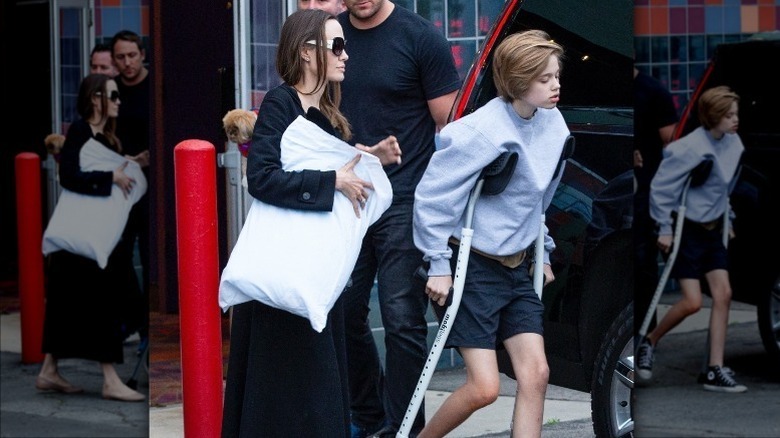 Shiloh Jolie-Pitt on crutches with Angelina Jolie