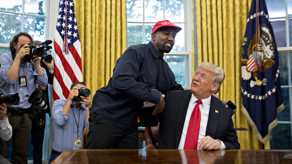 Kanye West posing with Donald Trump