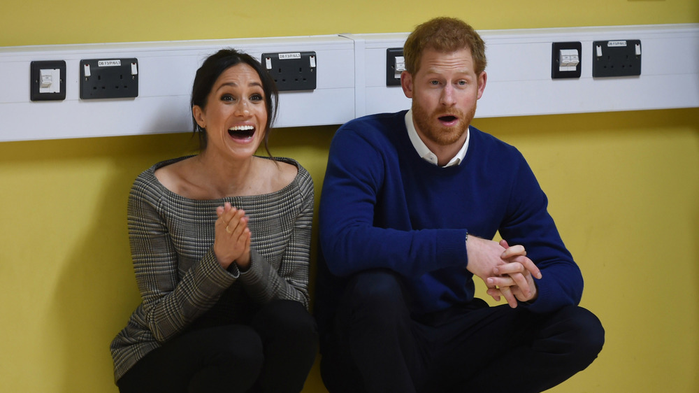 Meghan Markle and Prince Harry looking surprised