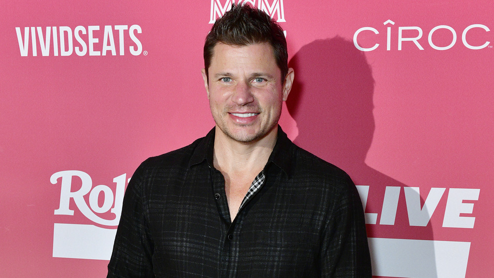 Nick Lachey smiling on the red carpet