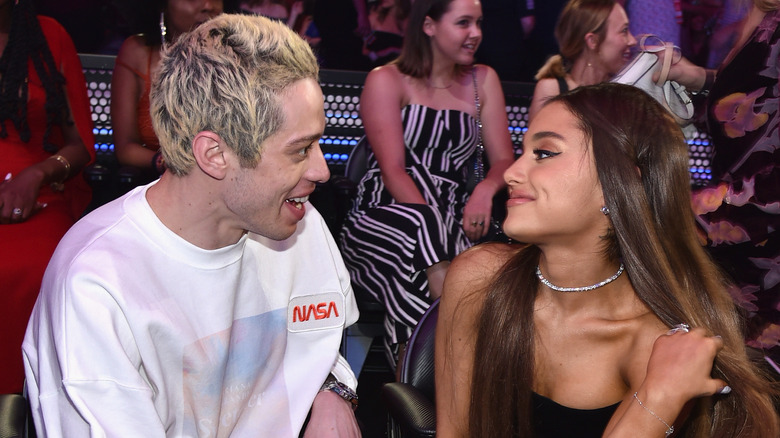 Pete Davidson and Ariana Grande smiling