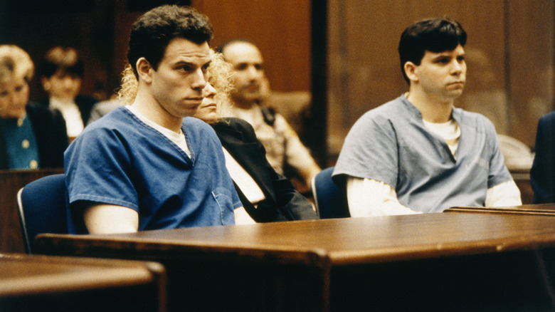 The Menendez brothers sitting side-by-side during their trial.