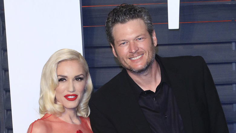 Gwen Stefani and Blake Shelton posing at an event