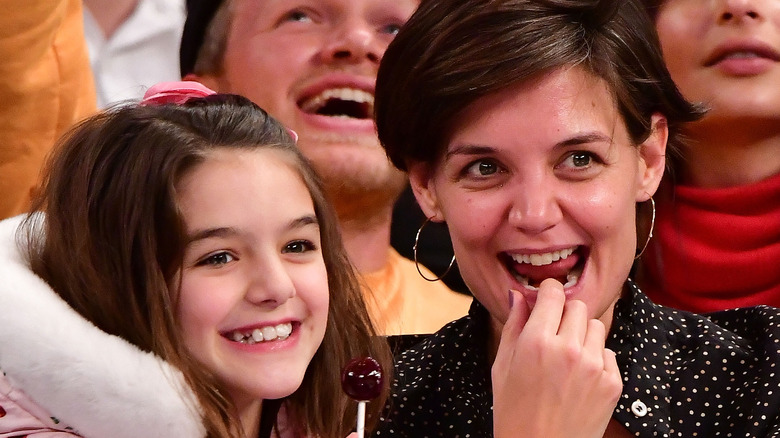 Suri Cruise smiling Katie Holmes laughing