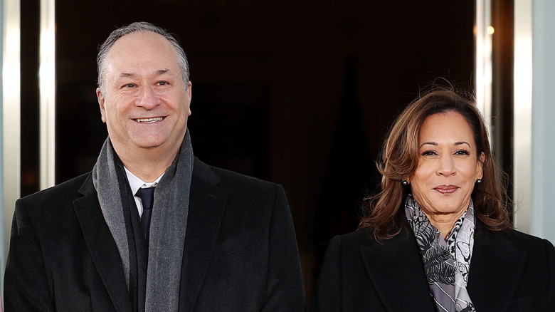 Doug Emhoff stands next to to Kamala Harris