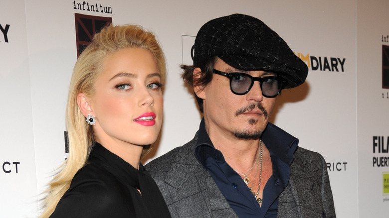 Amber Heard diamond earrings Johnny Depp flat cap