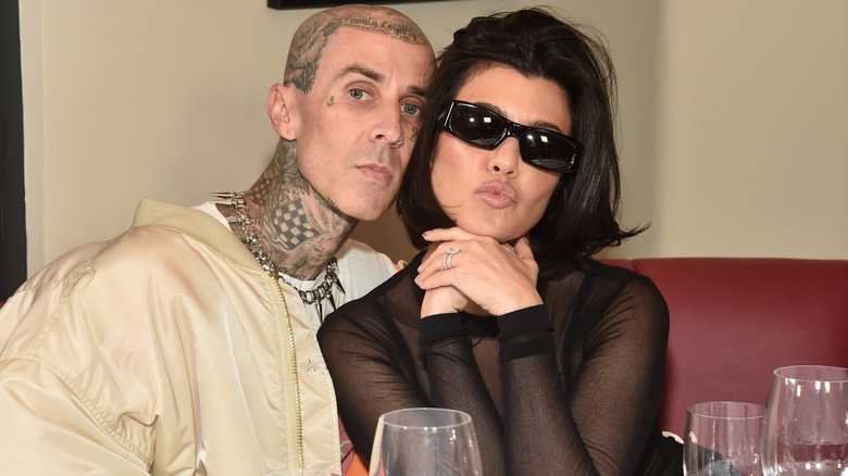 Travis Barker Kourtney Kardashian kissy face