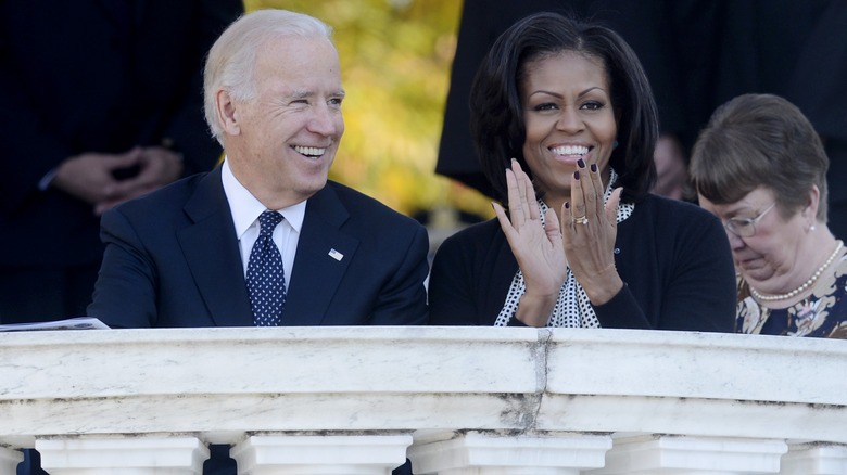 Joe Biden and Michelle Obama grinning