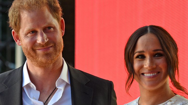 Prince Harry and Meghan Markle smiling