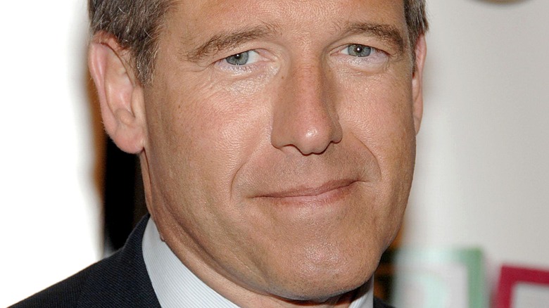 Brian Williams crooked smile black suit