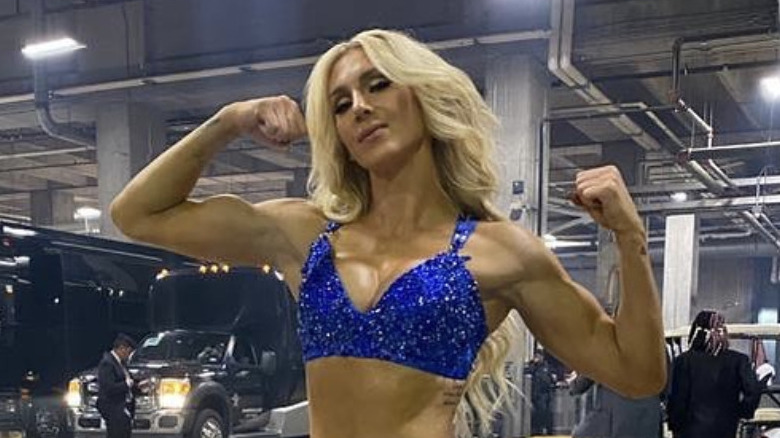 Charlotte Flair showing off muscles