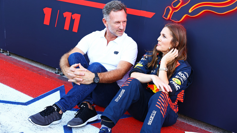 Drew Barrymore sitting and talking to a man