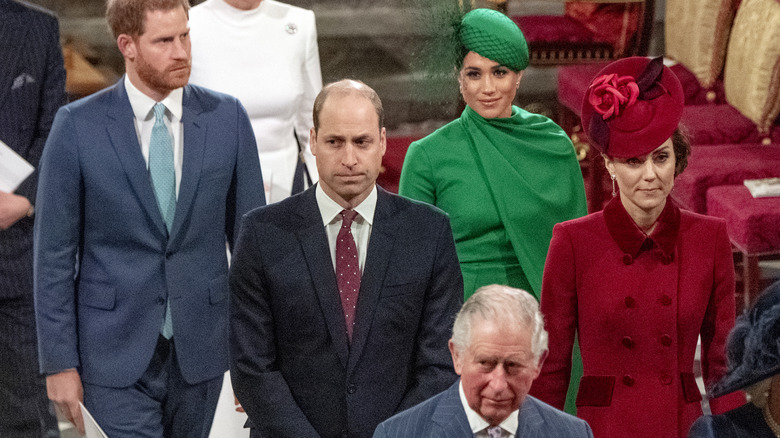 Prince William, Prince Harry, Kate Middleton, and Meghan Markle walking