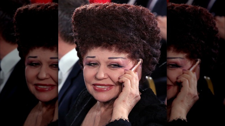 Valentina Petrenko, hair square, talking on her cell phone