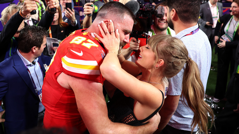 Travis Kelce and Taylor Swift rejoicing at the Super Bowl