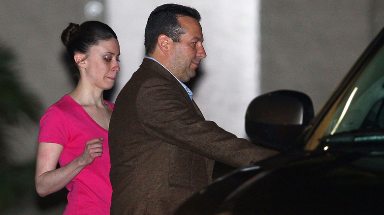 Casey Anthony and Jose Baez entering a car 