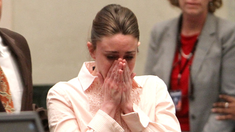 Casey Anthony hands covering face 