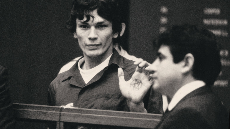 Richard Ramirez showing a pentagram on his hand