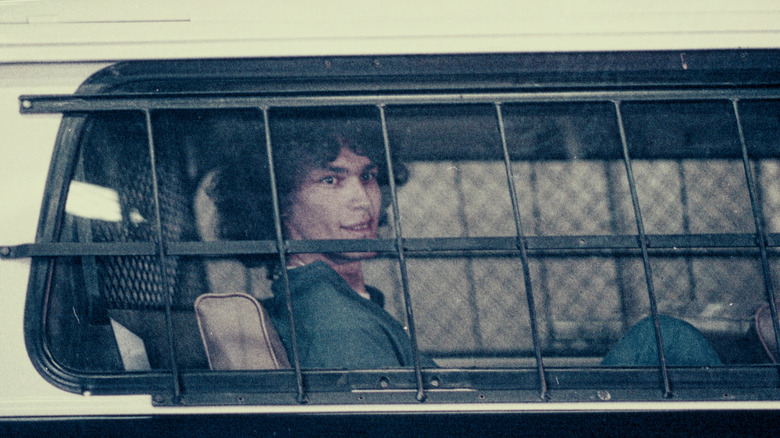 Richard Ramirez being escorted in police car